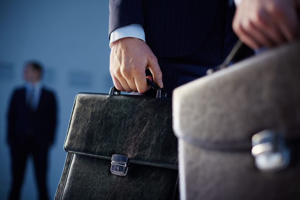 close up workers with briefcases